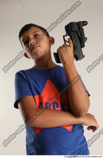 TIMBO STANDING POSE WITH GUN